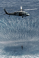 MH-60S Hoists SAR Swimmer