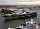 CVN 71 steams past HII HQ